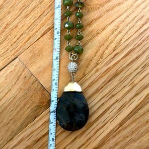 Olive green pendant necklace with gold detail